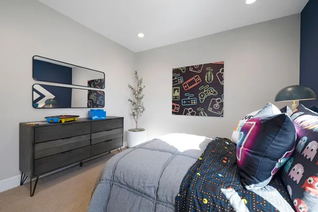 a bedroom with bed and a window