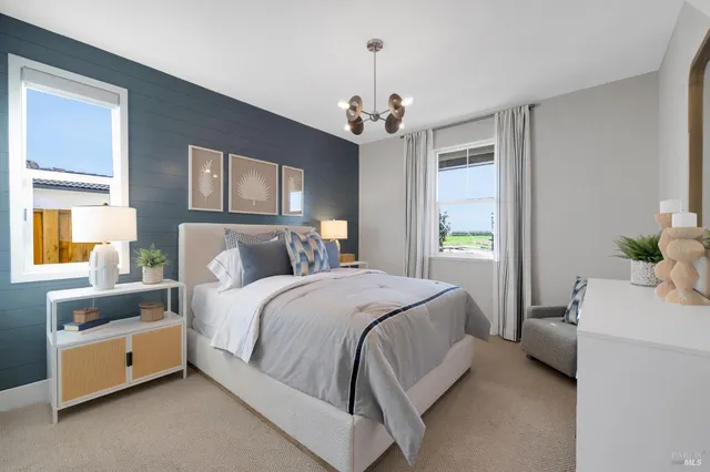 a bedroom with a bed and a table in it