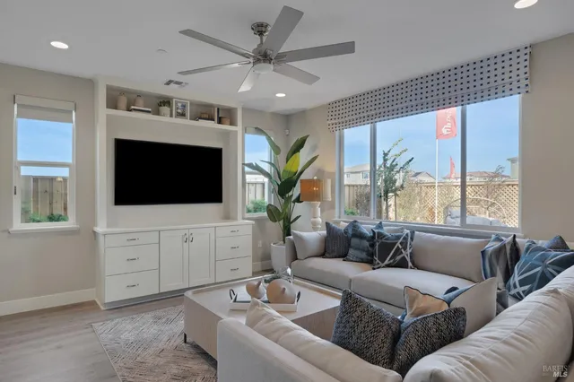 a view of an outdoor dining space with a table and chairs