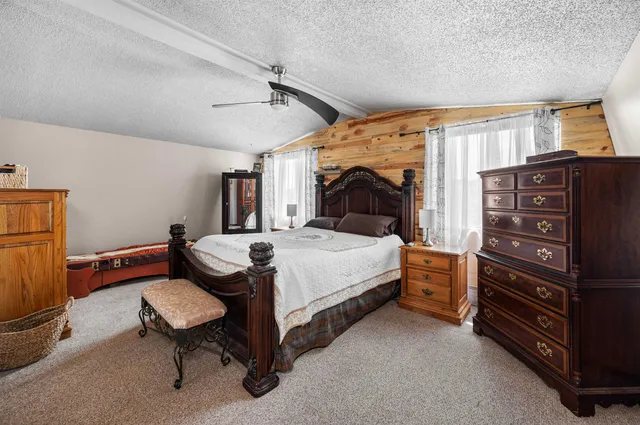 a bedroom with a bed and furniture