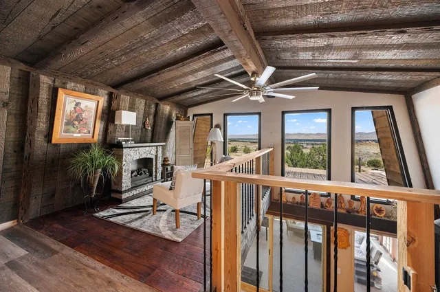 a view of a porch with furniture and floor to ceiling window