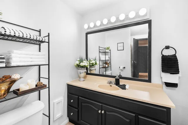 a bathroom with a sink and a mirror