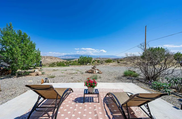 a view of a terrace with furniture and a table