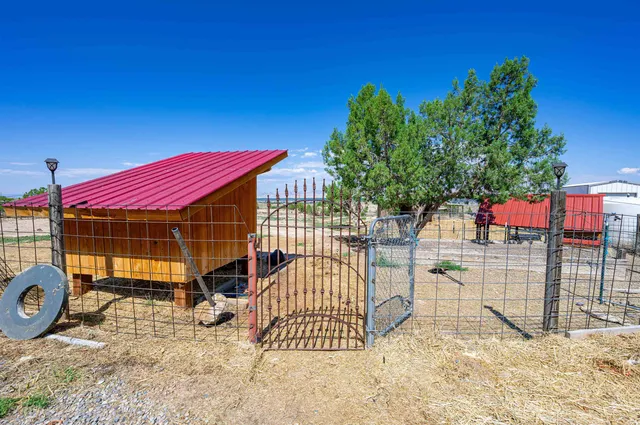 a view of a backyard with a wooden deck