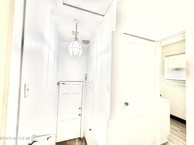 a bathroom with a shower and a mirror