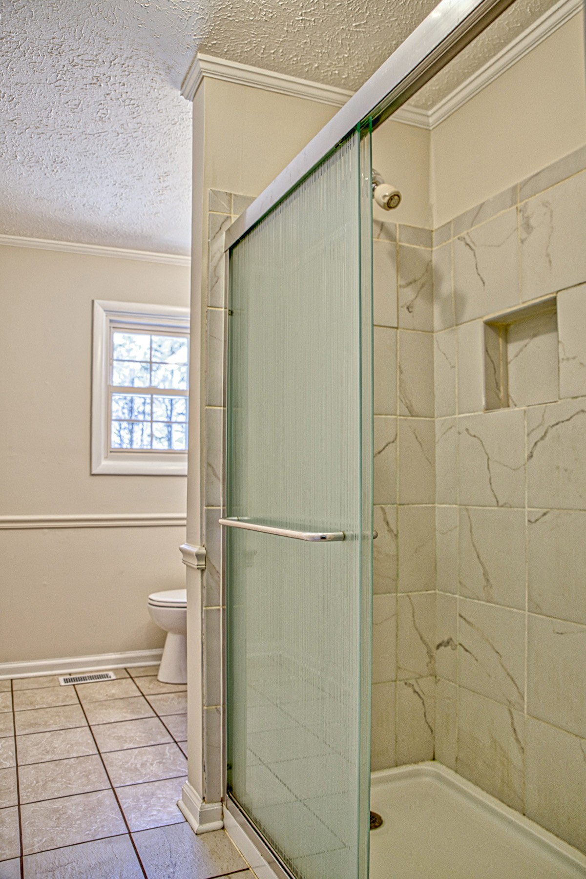 2085 Herbert Garrett Road Cookeville, TN 38506 - Photo 22 of 39 a bathroom with a shower and a toilet