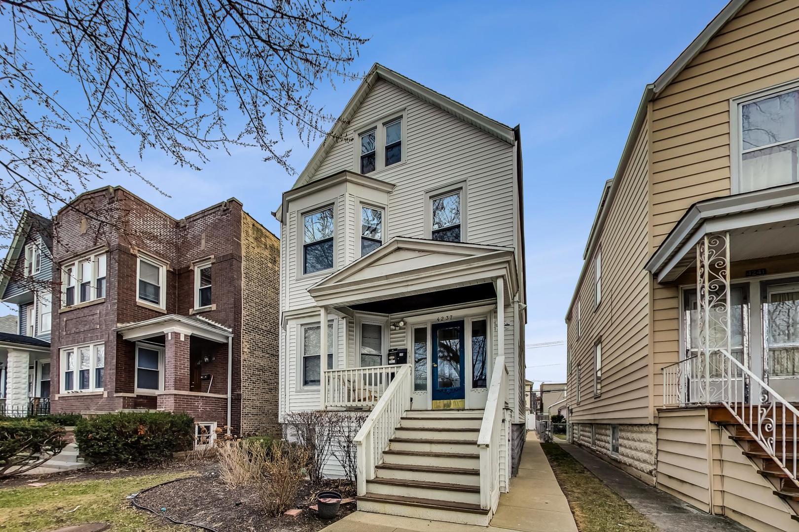 4237 West School Street Chicago, IL 60641 - Photo 2 of 72 a front view of a house