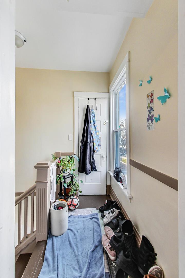 4237 West School Street Chicago, IL 60641 - Photo 22 of 72 a living room with furniture and a wooden floor