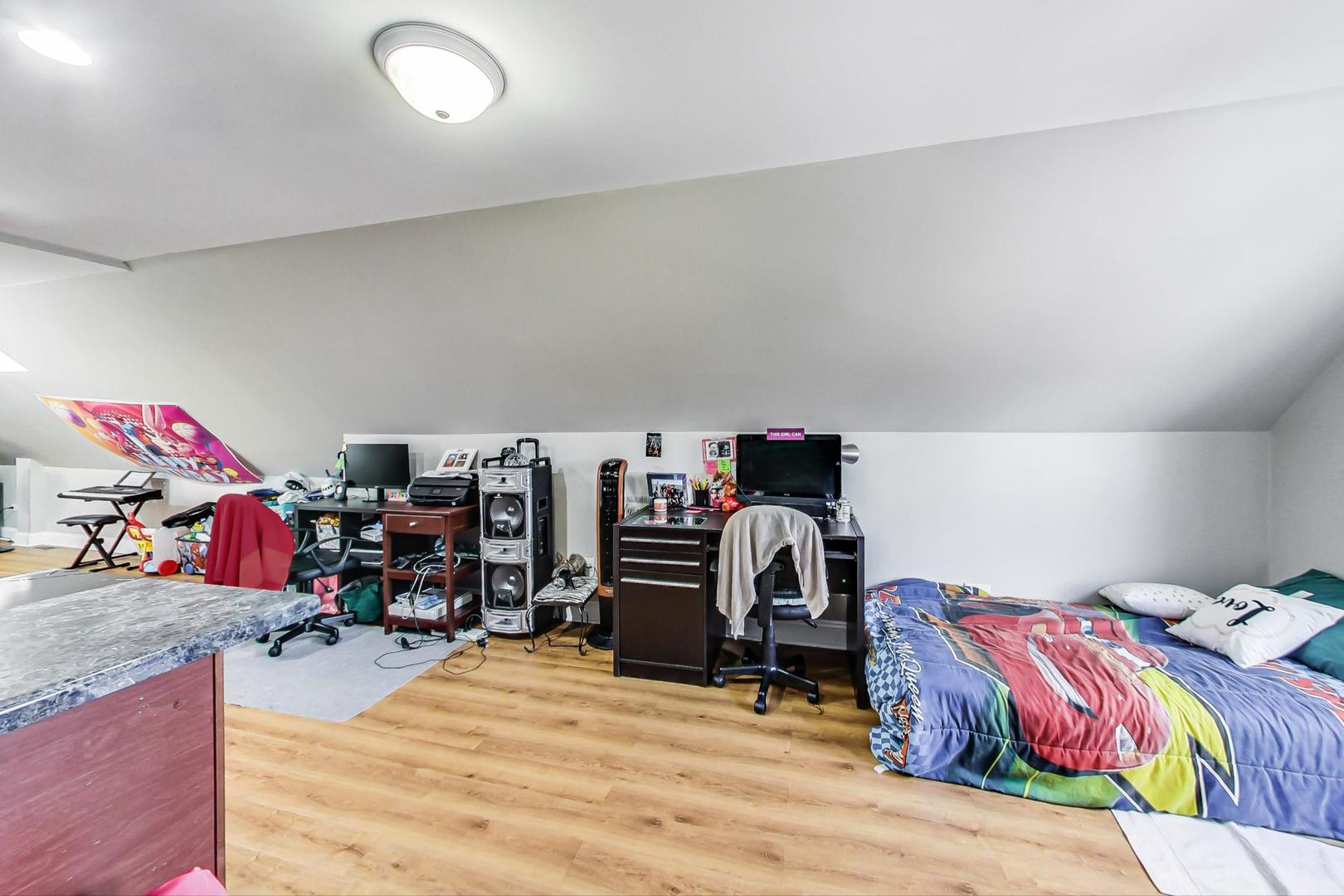 4237 West School Street Chicago, IL 60641 - Photo 42 of 72 a bedroom with a bed and wooden floor