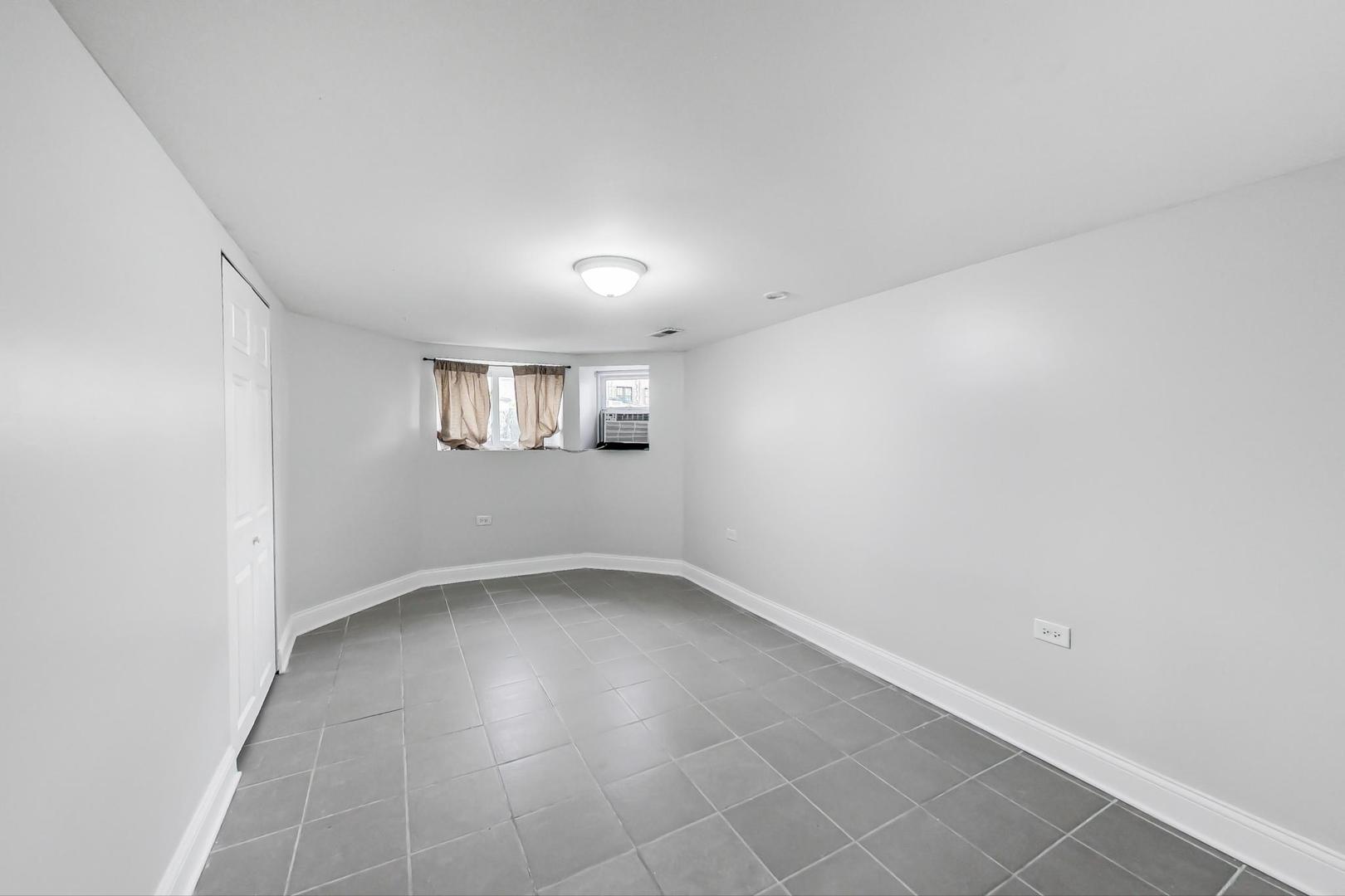 4237 West School Street Chicago, IL 60641 - Photo 57 of 72 an empty room with a empty space and windows