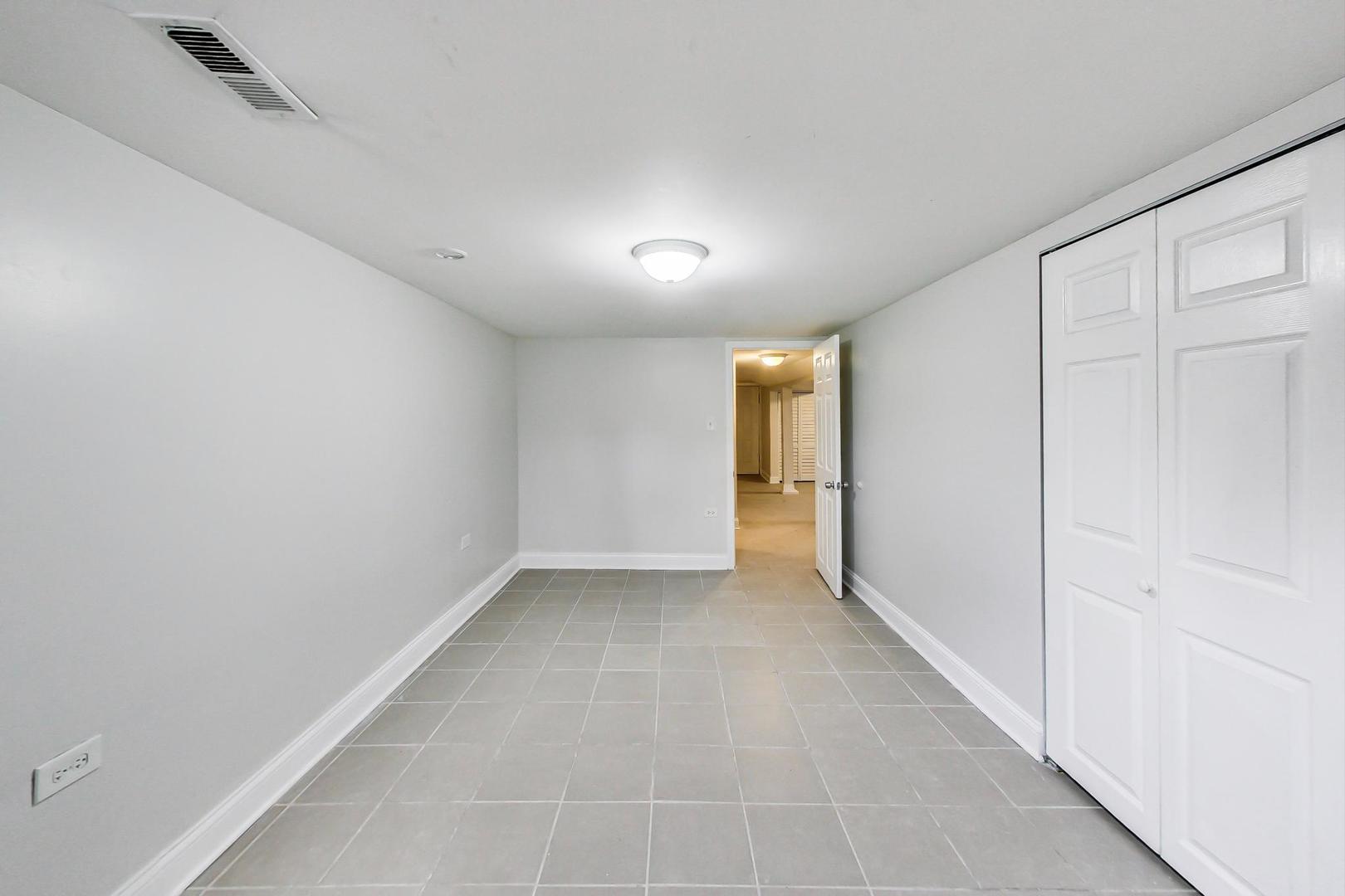 4237 West School Street Chicago, IL 60641 - Photo 58 of 72 an empty room with a natural light