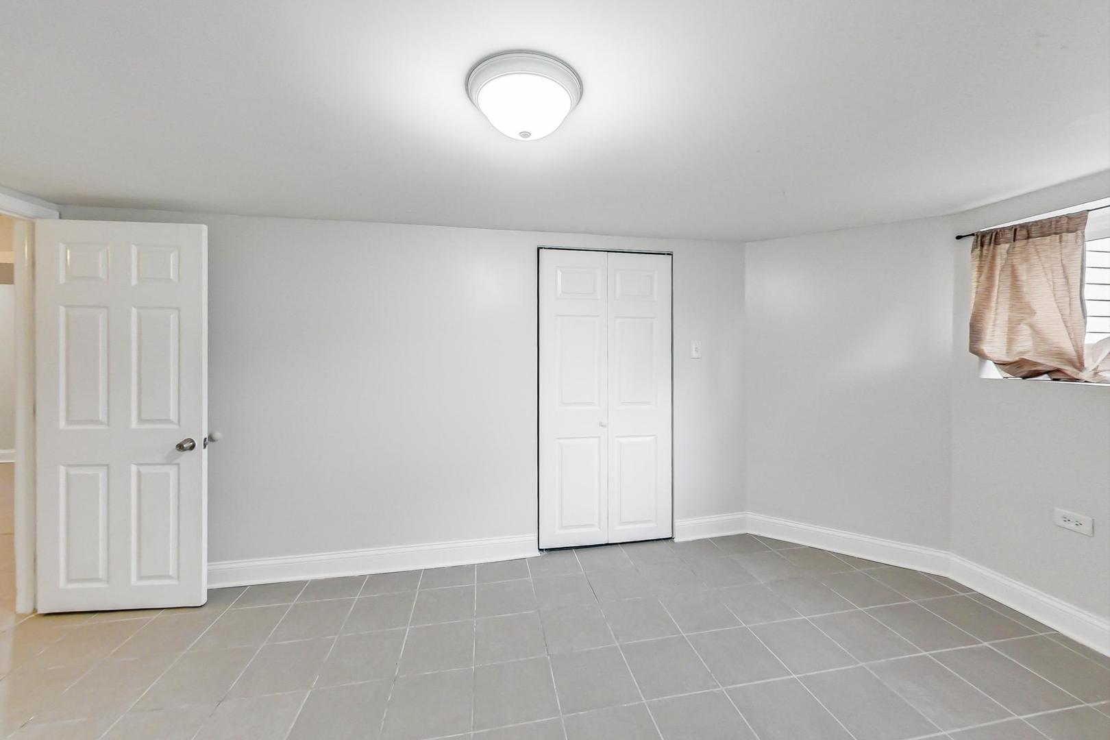 4237 West School Street Chicago, IL 60641 - Photo 59 of 72 an empty room with a empty space and windows