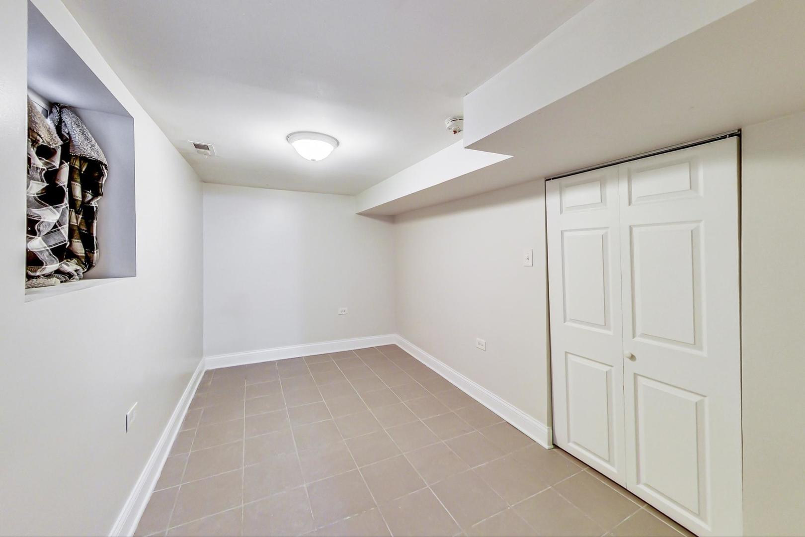 4237 West School Street Chicago, IL 60641 - Photo 60 of 72 an empty room with a empty space and windows