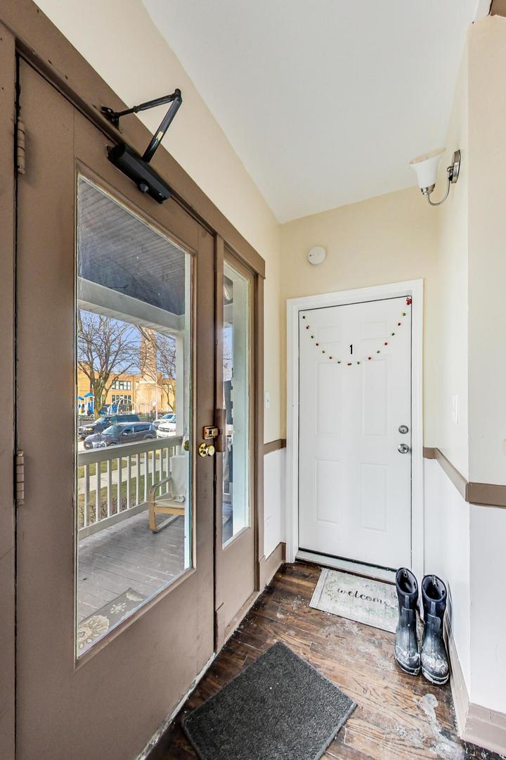 4237 West School Street Chicago, IL 60641 - Photo 6 of 72 a view of a livingroom with a tub and wooden floor