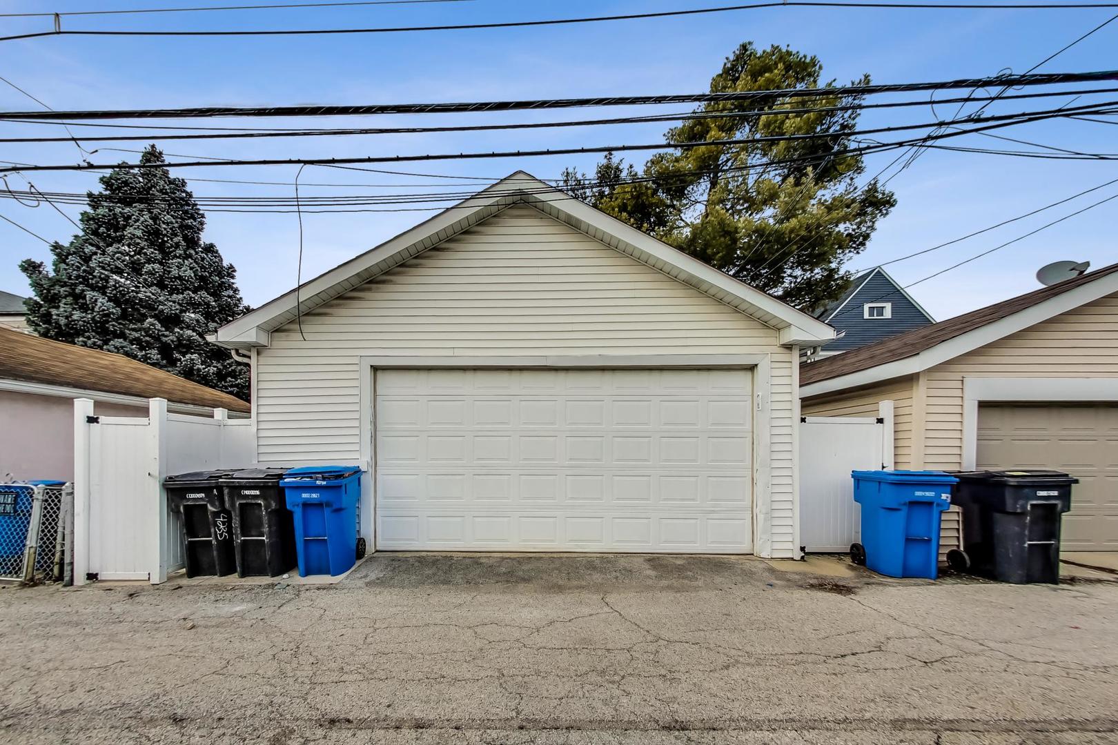 4237 West School Street Chicago, IL 60641 - Photo 68 of 72 a view of a house with a garage