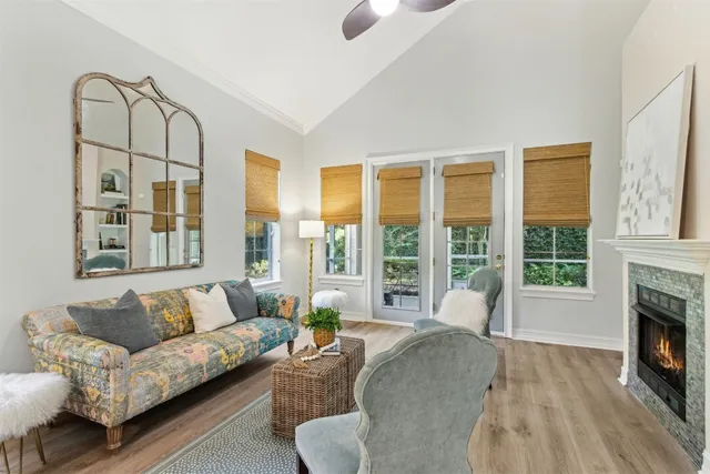 a view of a dining room with furniture and a chandelier
