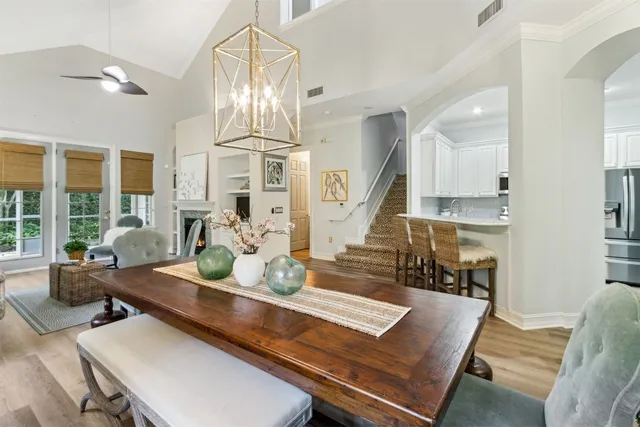 a kitchen with stainless steel appliances granite countertop a refrigerator stove and sink