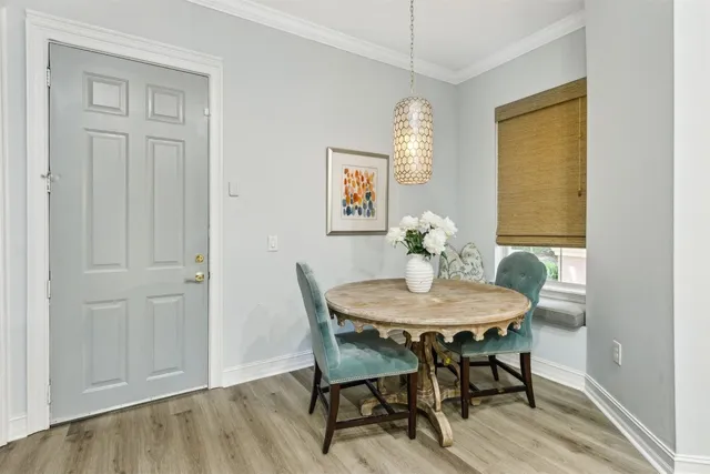 a bathroom with a granite countertop sink mirror vanity and toilet