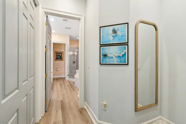 a bathroom with a double vanity sink mirror and shower
