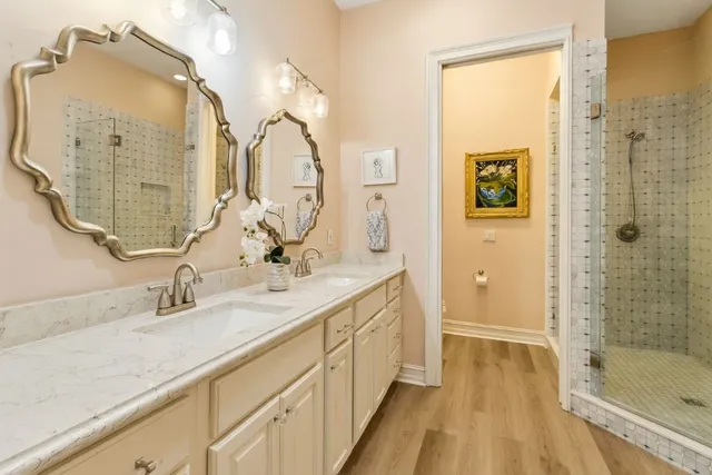 a white toilet sitting next to a white tub