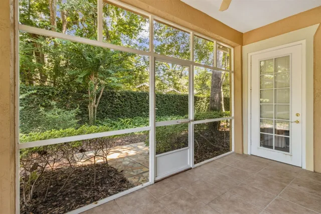 a view of a brick house with a yard