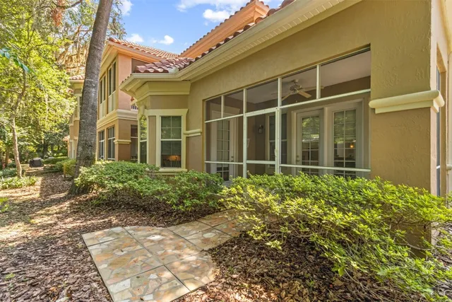 a sign that is sitting in front of flowers