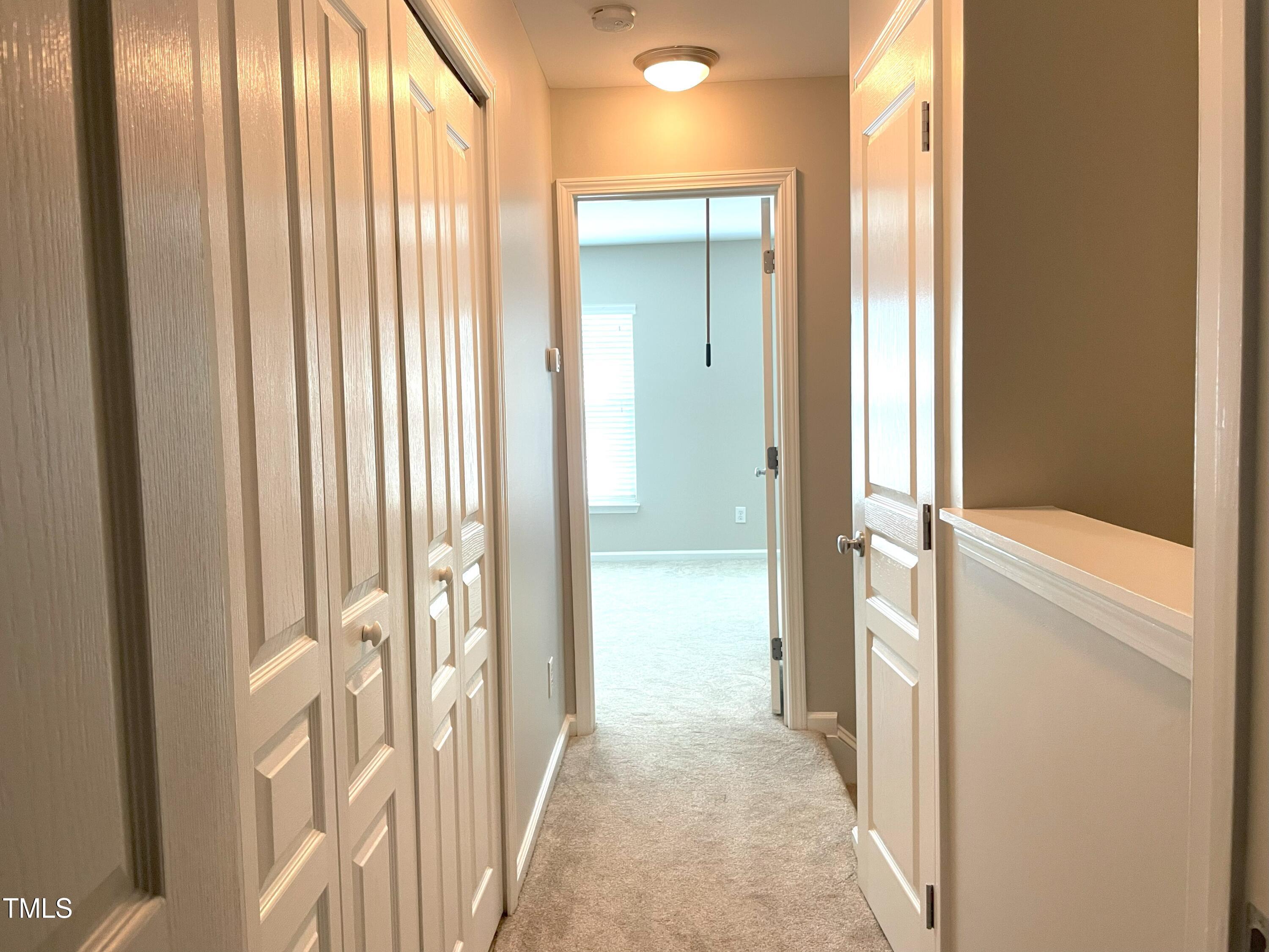 224 Broadgait Brae Road Cary, NC 27519 - Photo 13 of 19 a view of a bathroom from a hallway