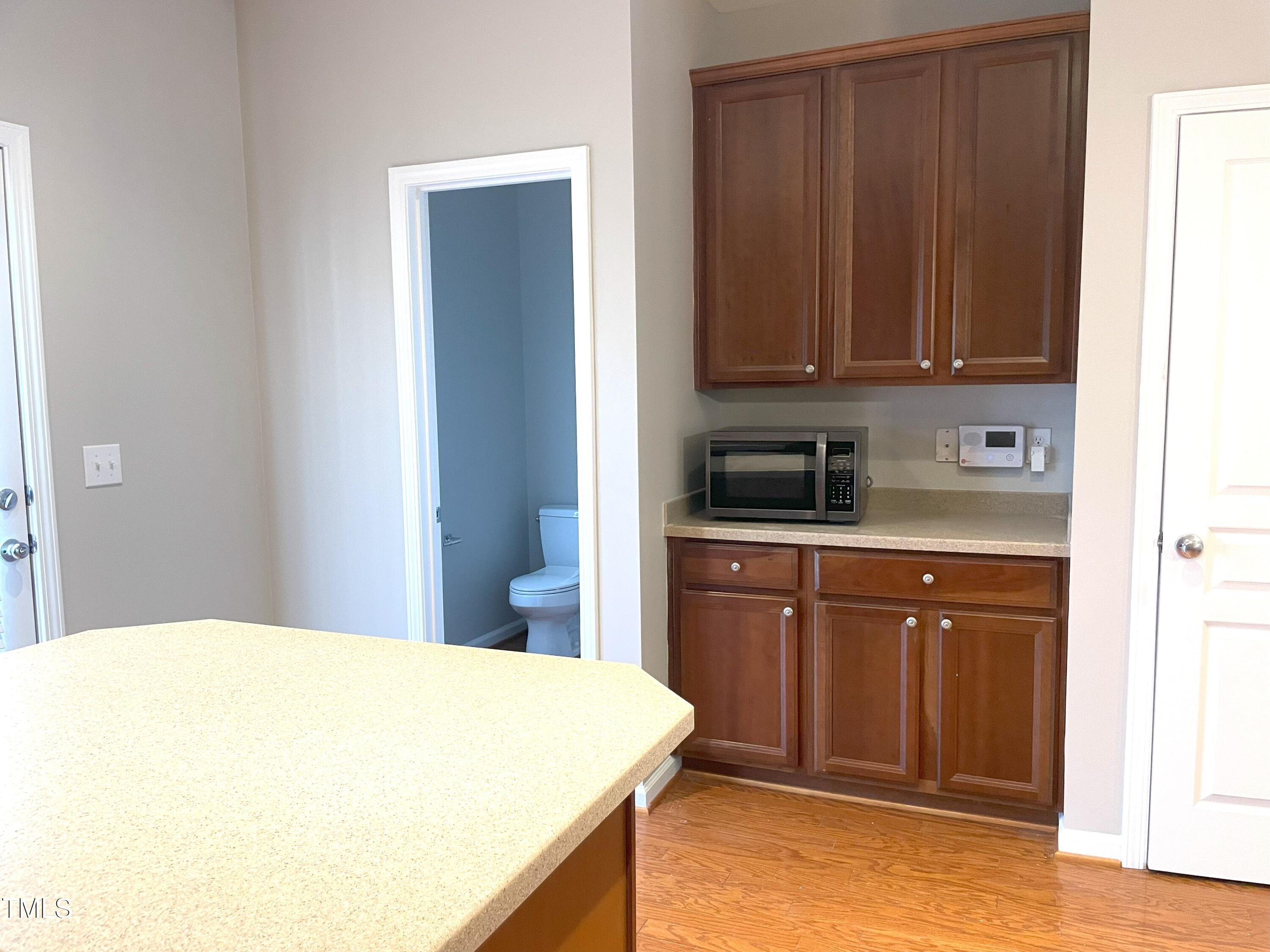 224 Broadgait Brae Road Cary, NC 27519 - Photo 18 of 19 a kitchen with a sink and cabinets