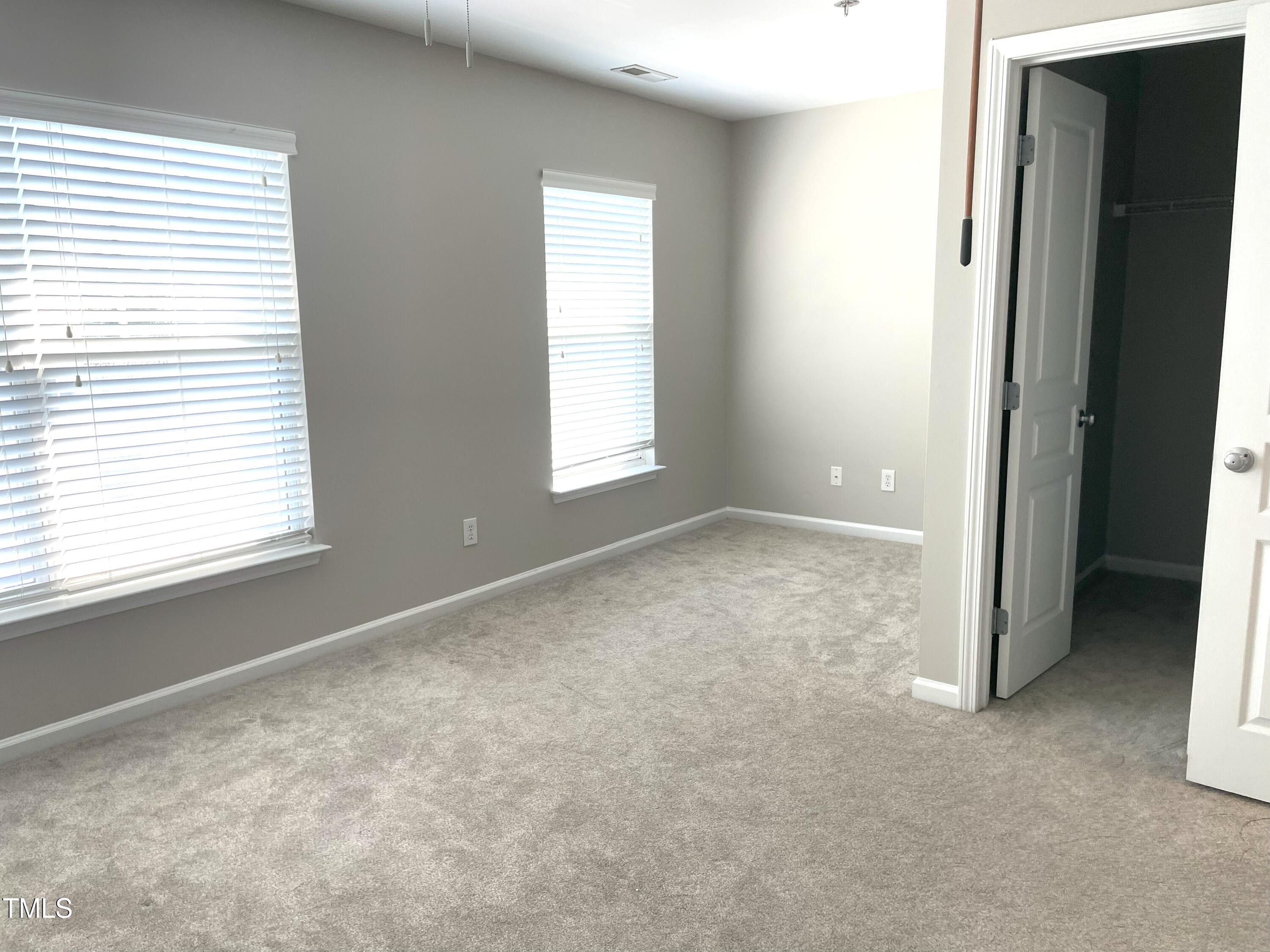 224 Broadgait Brae Road Cary, NC 27519 - Photo 10 of 19 an empty room with windows
