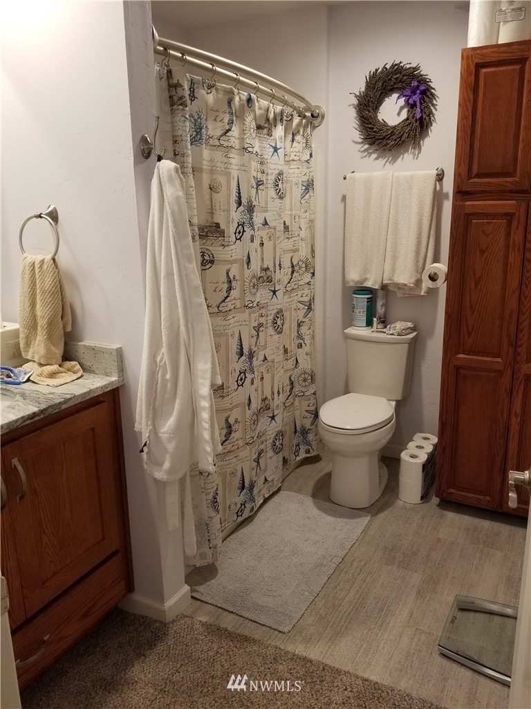 98 Armadale Road, Unit 211 San Juan Island, WA 98250 - Photo 11 of 15 a bathroom with a sink toilet and shower