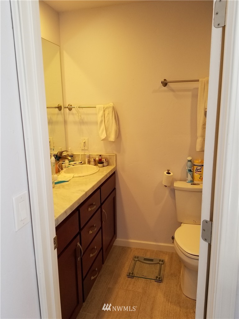 98 Armadale Road, Unit 211 San Juan Island, WA 98250 - Photo 12 of 15 a bathroom with a granite countertop sink toilet and shower
