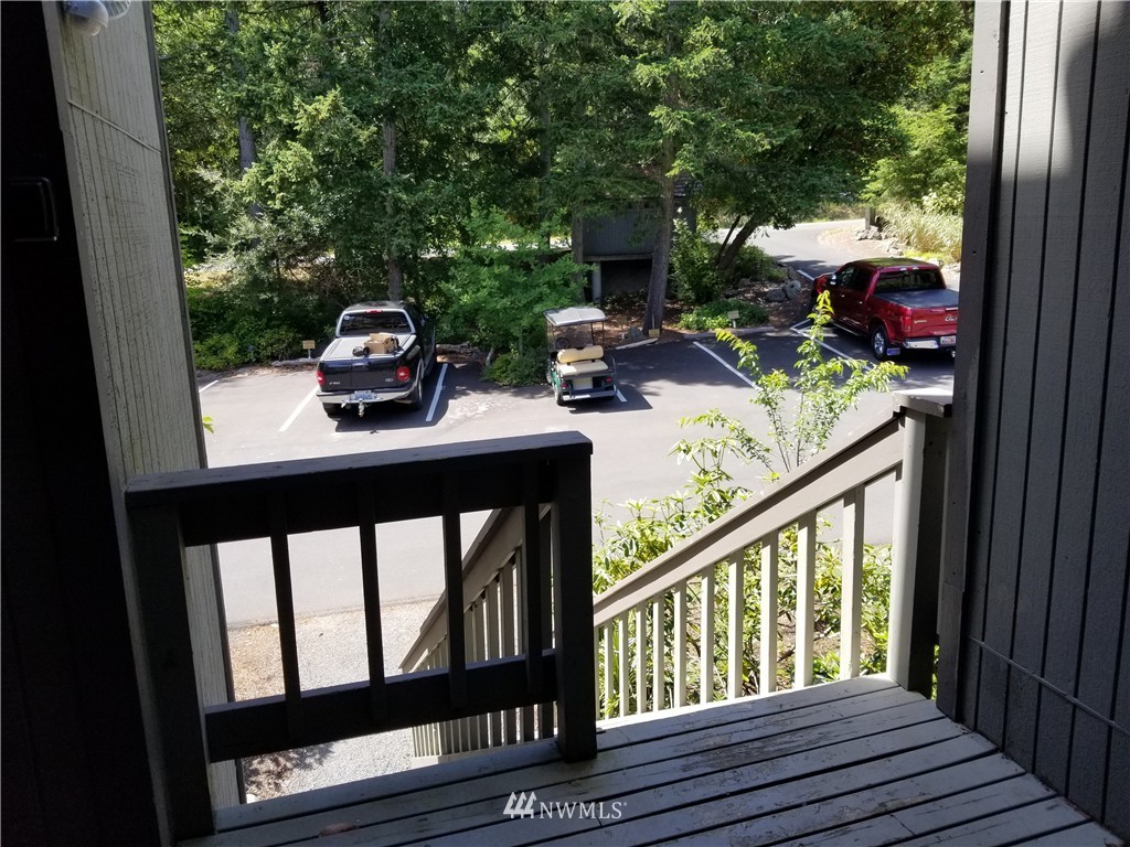 98 Armadale Road, Unit 211 San Juan Island, WA 98250 - Photo 3 of 15 a view of balcony with furniture and garden