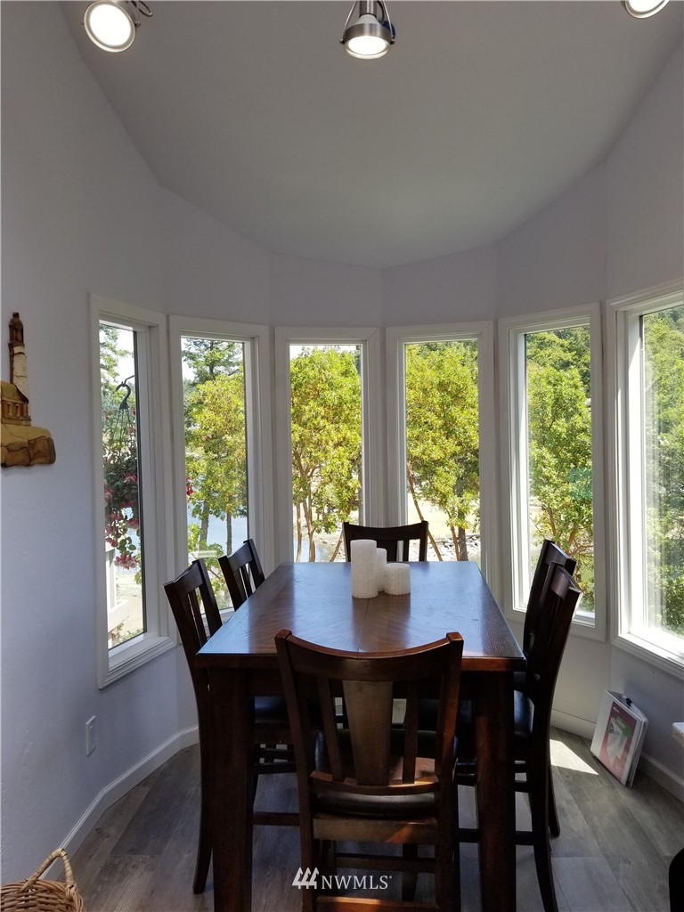 98 Armadale Road, Unit 211 San Juan Island, WA 98250 - Photo 4 of 15 a view of a dining room with furniture and window