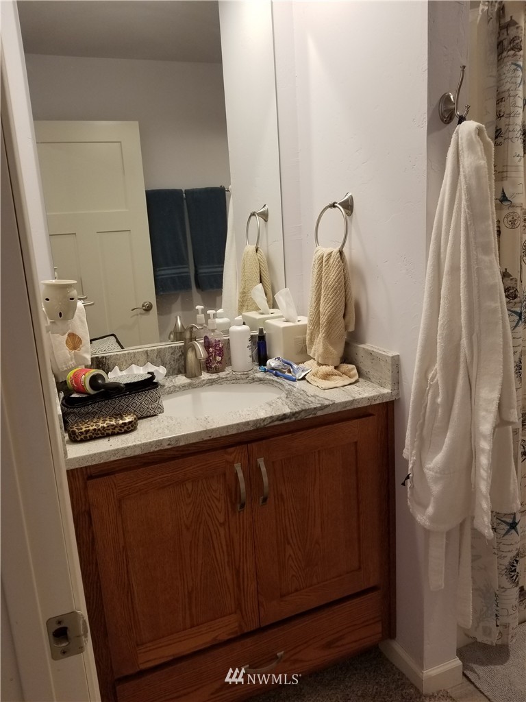 98 Armadale Road, Unit 211 San Juan Island, WA 98250 - Photo 10 of 15 a bathroom with a double vanity sink and a mirror