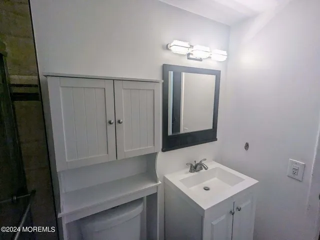 a view of a balcony with floor to ceiling window