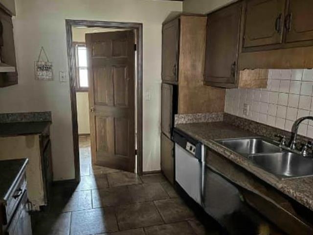 6065 Pine Top Road Henderson, TN 38340 - Photo 5 of 8 a kitchen with stainless steel appliances granite countertop a sink stove and refrigerator