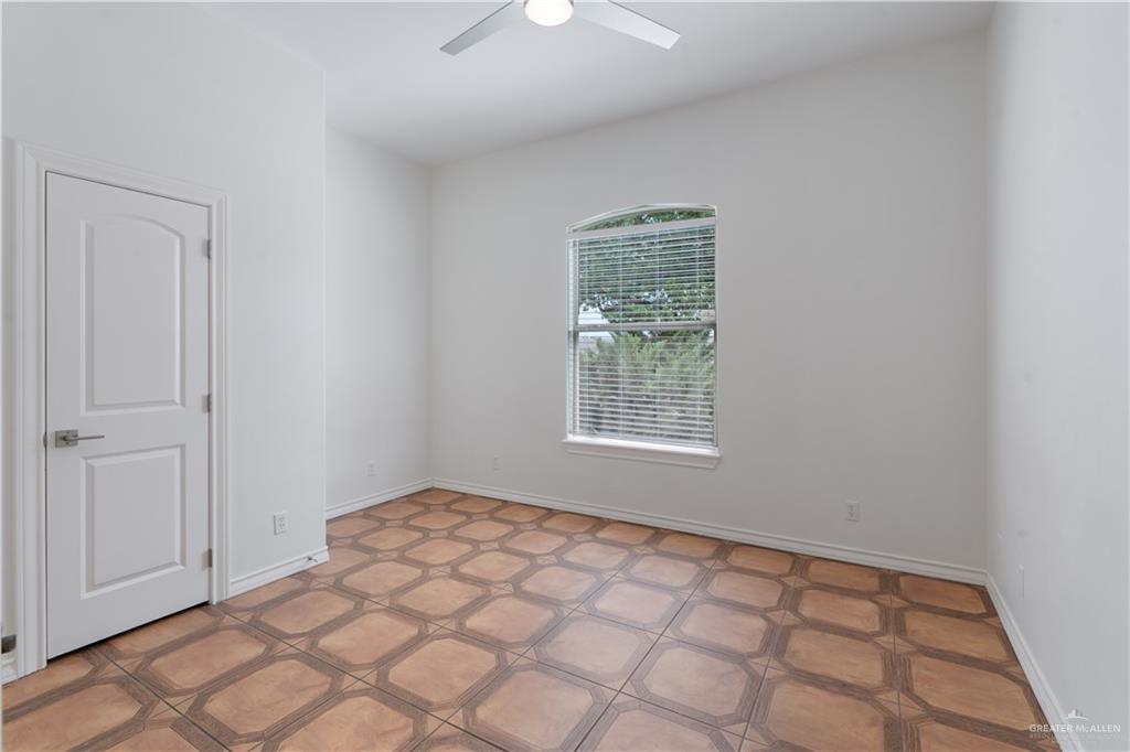 3315 Omega Street Edinburg, TX 78539 - Photo 12 of 19 Spare room with baseboards and ceiling fan