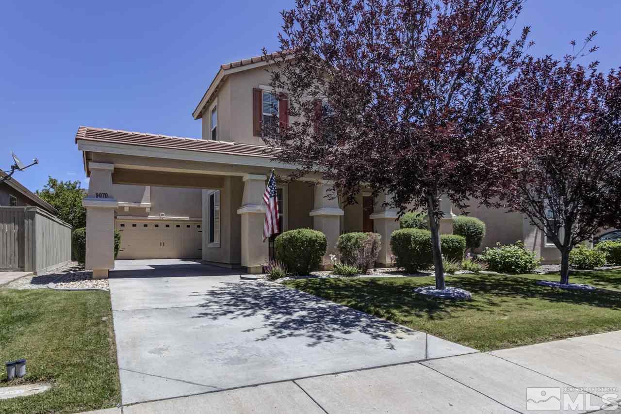 9070 Jack Hammer Drive Reno, NV 89521 - Photo 1 of 40 a front view of a house with a yard