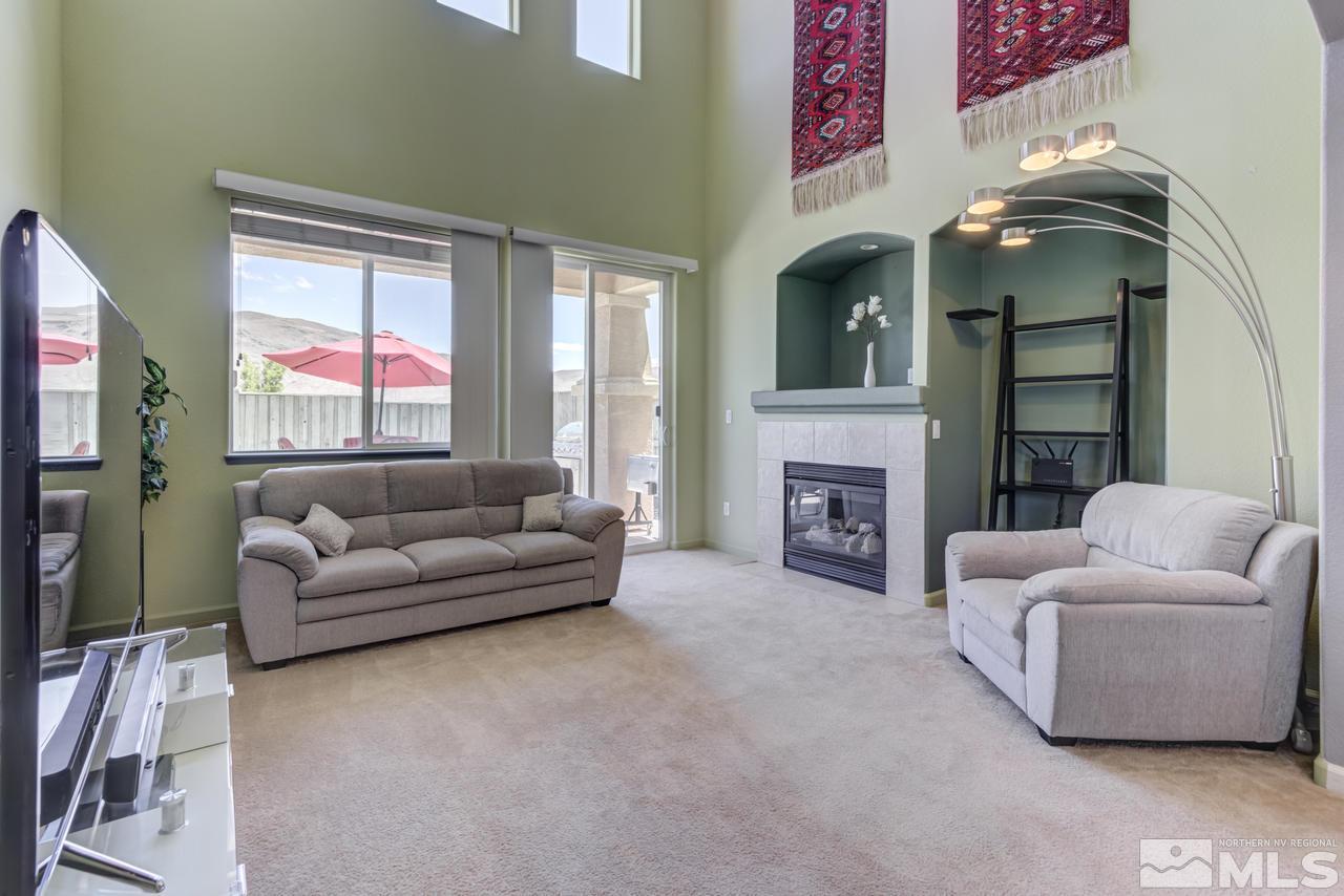 9070 Jack Hammer Drive Reno, NV 89521 - Photo 20 of 40 a living room with furniture and a fireplace