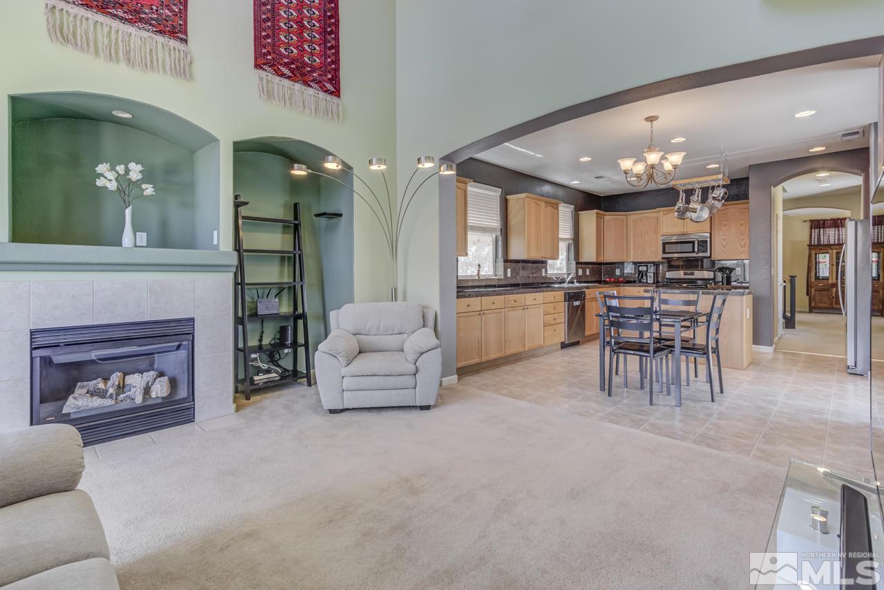 9070 Jack Hammer Drive Reno, NV 89521 - Photo 23 of 40 a living room with furniture and kitchen view