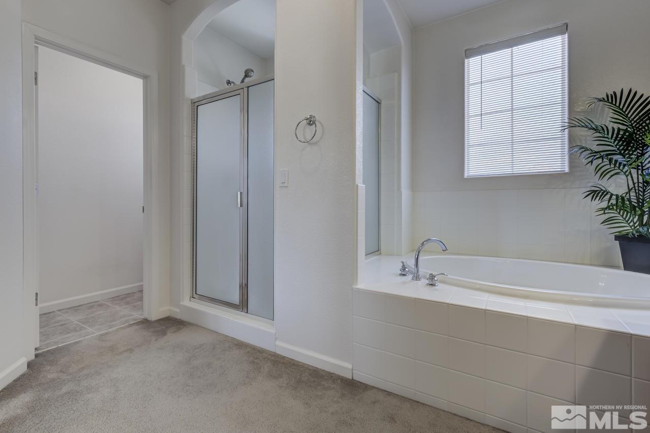 9070 Jack Hammer Drive Reno, NV 89521 - Photo 29 of 40 a bathroom with a bathtub and a sink