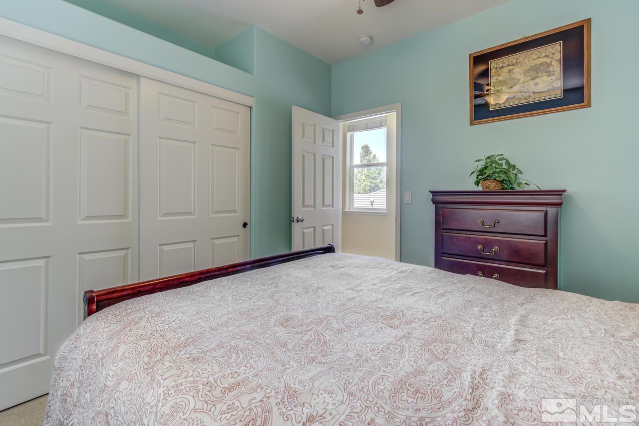9070 Jack Hammer Drive Reno, NV 89521 - Photo 31 of 40 a room with a bed and a window