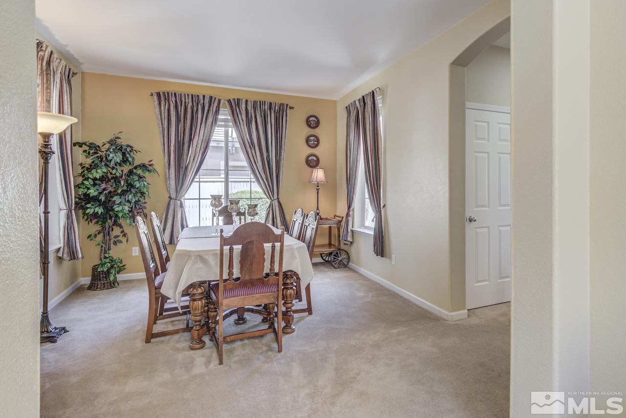 9070 Jack Hammer Drive Reno, NV 89521 - Photo 6 of 40 a view of a livingroom with furniture and window
