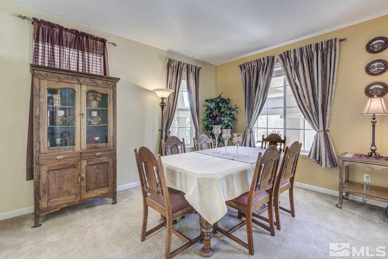 9070 Jack Hammer Drive Reno, NV 89521 - Photo 7 of 40 a view of a dining room with furniture window and wooden floor
