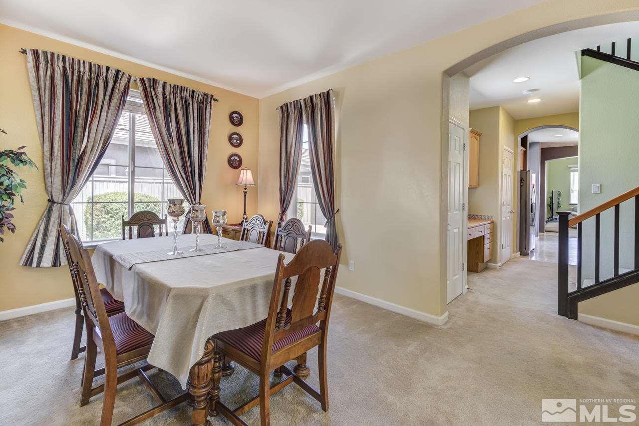 9070 Jack Hammer Drive Reno, NV 89521 - Photo 10 of 40 a view of a a dining room with furniture window and wooden floor