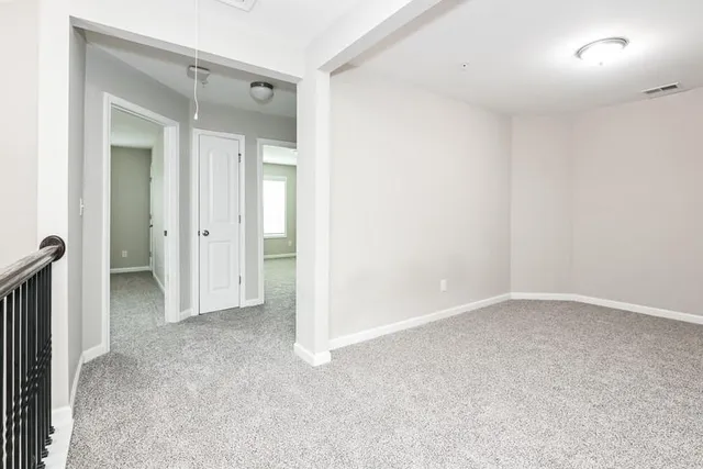 an empty room with a bathroom