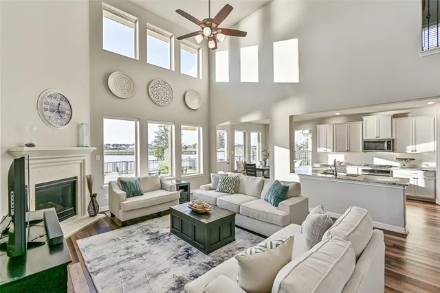 a spacious bathroom with a tub double sink and a mirror