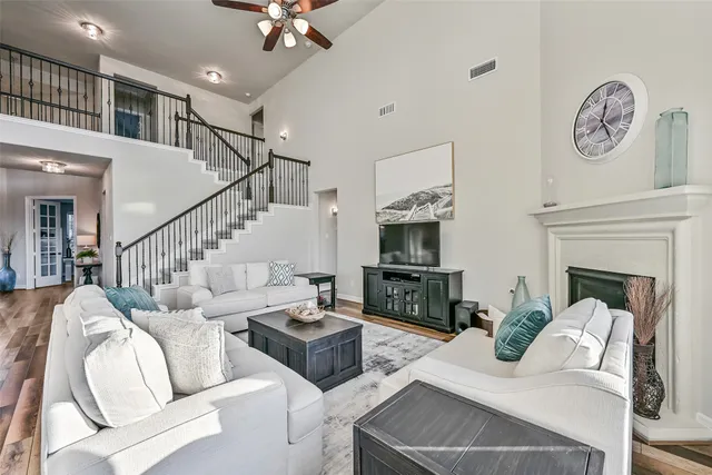 a bathroom with a sink vanity tub shower and a mirror