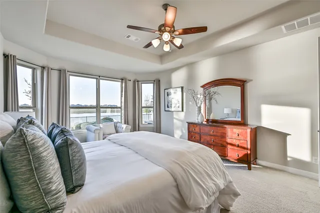 a bathroom with a double vanity sink a mirror and a shower