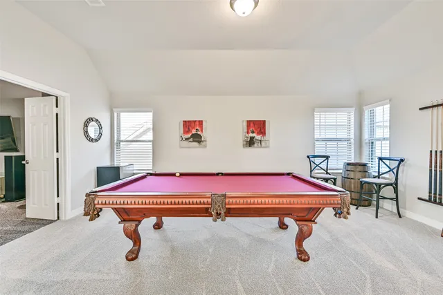 a view of a chairs with potted plants in front of house